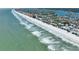 Expansive aerial view of beachfront property featuring ocean views, coastal homes and sandy shorelines at 812 Gulf # 3, Indian Rocks Beach, FL 33785