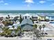 Aerial view of the charming beach community and the property with views of the ocean in the background at 812 Gulf # 3, Indian Rocks Beach, FL 33785