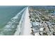 Expansive aerial view of beachfront property featuring ocean views, coastal homes and sandy shorelines at 812 Gulf # 3, Indian Rocks Beach, FL 33785