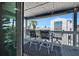 Stylish outdoor balcony with bar height seating, offering a relaxing space with pleasant views at 812 Gulf # 3, Indian Rocks Beach, FL 33785