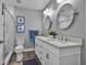Stylish bathroom with double sinks, modern fixtures, and a glass-enclosed shower at 812 Gulf # 3, Indian Rocks Beach, FL 33785