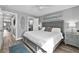 Comfortable bedroom with a view into the bathroom and featuring tasteful decor and gray wall paint at 812 Gulf # 3, Indian Rocks Beach, FL 33785