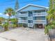 Charming multi-story beach house with spacious balconies, parking, and tropical landscaping at 812 Gulf # 3, Indian Rocks Beach, FL 33785