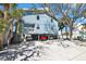 Multi-story home with parking underneath, lush tropical landscaping and balconies at 812 Gulf # 3, Indian Rocks Beach, FL 33785