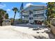 Elevated coastal home with dual balconies, parking underneath and lush landscaping at 812 Gulf # 3, Indian Rocks Beach, FL 33785
