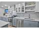 Modern kitchen features stainless steel appliances, stylish backsplash, and bright white countertops at 812 Gulf # 3, Indian Rocks Beach, FL 33785