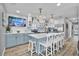 Beautiful kitchen with stainless steel appliances, island with seating, and stylish backsplash at 812 Gulf # 3, Indian Rocks Beach, FL 33785