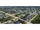 Expansive aerial view of a waterfront community with canals and homes nestled among lush greenery at 9150 Arrid Cir, Port Charlotte, FL 33981