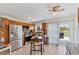 Modern kitchen with stainless steel appliances, sleek countertops, and a center island at 9150 Arrid Cir, Port Charlotte, FL 33981