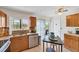 Bright kitchen featuring granite countertops, stainless steel appliances, and a breakfast bar area at 9150 Arrid Cir, Port Charlotte, FL 33981