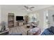 Bright living room with neutral walls and tile flooring, comfortable seating and a sunlit window at 9150 Arrid Cir, Port Charlotte, FL 33981