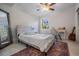 This bedroom features a bed, a vanity desk, and a ceiling fan at 107 S Obrien St # 117, Tampa, FL 33609