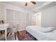 A charming bedroom featuring a large window, closet and a comfortable bed at 107 S Obrien St # 117, Tampa, FL 33609