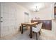 Bright dining room features a rustic table with seating and large storage cabinets at 107 S Obrien St # 117, Tampa, FL 33609