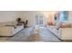 Bright living room featuring tile floors, neutral walls, modern furniture, and glass coffee table at 107 S Obrien St # 117, Tampa, FL 33609