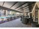 Covered patio with outdoor dining table and seating overlooking a fenced community pool at 107 S Obrien St # 117, Tampa, FL 33609