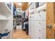 A well-organized walk-in closet with custom shelving and drawers, ideal for storage at 107 S Obrien St # 117, Tampa, FL 33609