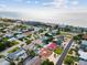 Stunning aerial view of a beach neighborhood showcasing lush landscaping and waterfront homes near the ocean at 108 24Th St, Belleair Beach, FL 33786