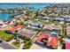 Beautiful waterfront homes with private pools and lush landscaping in a vibrant coastal community at 108 24Th St, Belleair Beach, FL 33786
