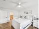 Bright, all-white bedroom features a ceiling fan and window at 108 24Th St, Belleair Beach, FL 33786