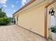 Exterior view of a well-maintained home with a spacious driveway and lush landscaping at 108 24Th St, Belleair Beach, FL 33786