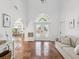 Inviting foyer with decorative tile, arched doorway and a view of the dining area at 108 24Th St, Belleair Beach, FL 33786