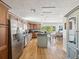 Spacious kitchen with center island, stainless steel appliances, and natural light at 108 24Th St, Belleair Beach, FL 33786