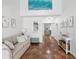 Bright living room with stylish decor, marble floors and comfortable seating area at 108 24Th St, Belleair Beach, FL 33786