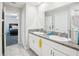 Bathroom featuring dual sinks with granite counters and tile floors, and access to a bedroom at 11218 Sage Canyon Dr, Riverview, FL 33578