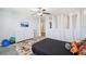 Bright bedroom with curtained off section, dresser, and ceiling fan at 11218 Sage Canyon Dr, Riverview, FL 33578