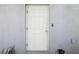 White front door providing a clean and secure entryway with an electronic keypad at 11218 Sage Canyon Dr, Riverview, FL 33578