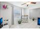 This room features tile flooring, a ceiling fan and a bar with shelving and storage at 11218 Sage Canyon Dr, Riverview, FL 33578