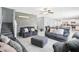 Spacious living room boasts tile floors, open floor plan, and decorative wood accent wall at 11218 Sage Canyon Dr, Riverview, FL 33578