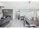 Spacious living area with tile flooring connects to the dining area, creating an open floor plan at 11218 Sage Canyon Dr, Riverview, FL 33578