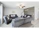 Bright and open living area with comfortable seating arrangements and a decorative accent wall at 11218 Sage Canyon Dr, Riverview, FL 33578