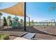 Community playground featuring a playset, swings and shade, ideal for activities at 11218 Sage Canyon Dr, Riverview, FL 33578