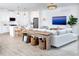 Inviting living room and kitchen with stylish decor, modern appliances, and ample natural light at 11795 Starbright Path, Venice, FL 34293