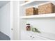 Functional built-in storage solution with open shelves and closed cabinets for seamless organization at 11795 Starbright Path, Venice, FL 34293