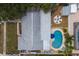 Aerial view of backyard with in-ground pool, firepit, shed and patio at 12299 91St N Ave, Seminole, FL 33772