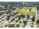 Aerial view of neighborhood near baseball fields and surrounded by lush trees at 12299 91St N Ave, Seminole, FL 33772