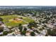 Aerial view of neighborhood near baseball fields and surrounded by lush trees at 12299 91St N Ave, Seminole, FL 33772