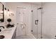 Updated bathroom featuring subway tile, modern fixtures, and a glass-enclosed shower at 12299 91St N Ave, Seminole, FL 33772