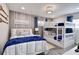 Kid-friendly bedroom with bunkbeds, twin bed, and nautical-themed decor at 12299 91St N Ave, Seminole, FL 33772