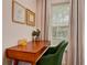 Office area with wooden desk, modern chair and natural light at 12299 91St N Ave, Seminole, FL 33772