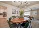 Dining room with view to the kitchen, stainless steel appliances, and living room at 12299 91St N Ave, Seminole, FL 33772