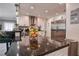 Bright kitchen with granite countertops, stainless steel appliances, and white cabinetry at 12299 91St N Ave, Seminole, FL 33772