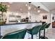 Modern kitchen with granite countertops, stainless steel appliances, and breakfast bar seating at 12299 91St N Ave, Seminole, FL 33772