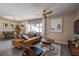 Comfortable living room with wood floors, exposed brick wall, sofa and view to the dining room at 12299 91St N Ave, Seminole, FL 33772