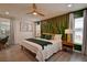 Modern bedroom with stylish decor, including a unique headboard and decorative lamps at 12299 91St N Ave, Seminole, FL 33772