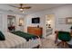 Tastefully decorated primary bedroom with desk and ensuite bathroom at 12299 91St N Ave, Seminole, FL 33772